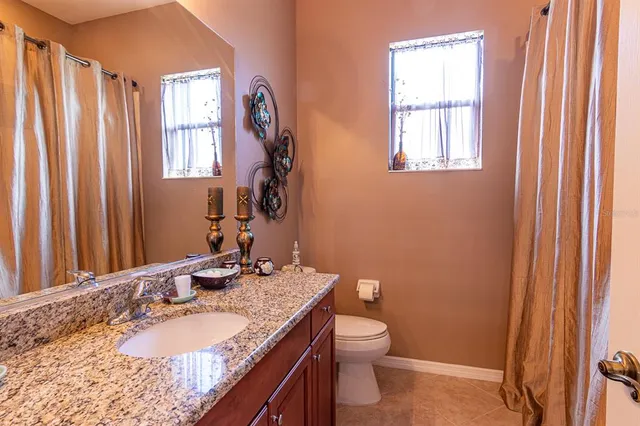 a dining room with furniture wooden floor and a potted plant