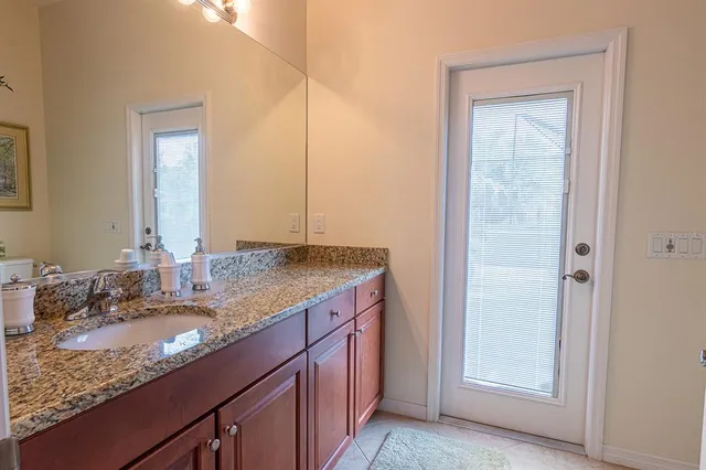 a view of a couches and dinning table in the balcony