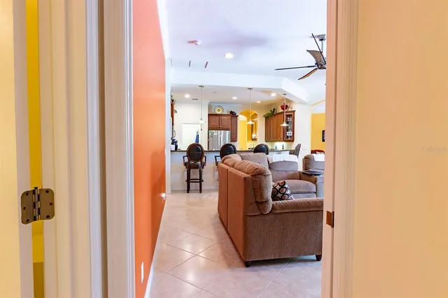 a view of a grassy field with trees in the background