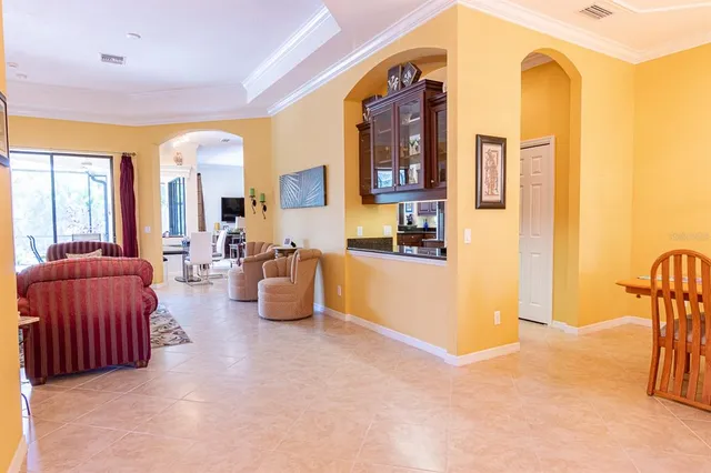 a view of a dining room with furniture and window