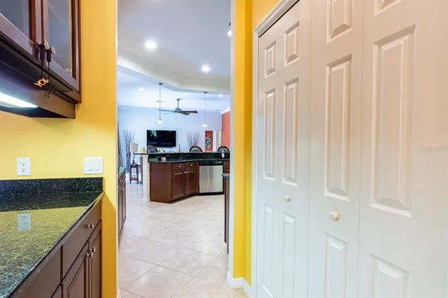a kitchen with granite countertop stainless steel appliances and wooden cabinets