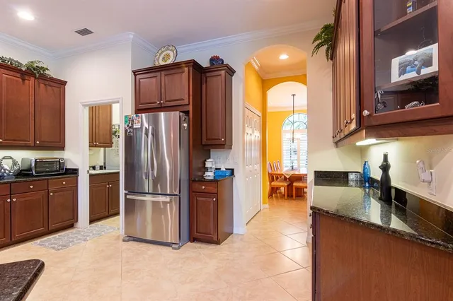 a large kitchen with stainless steel appliances and cabinets