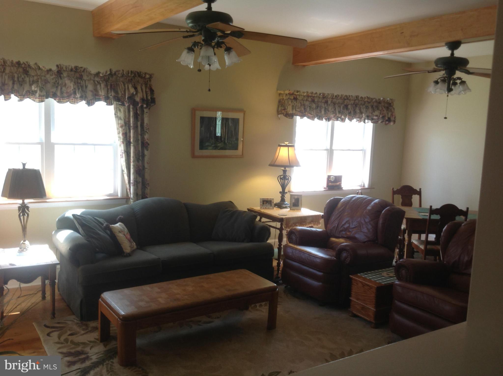 50295 Fresh Pond Neck Road Ridge, MD 20680 - Photo 8 of 10 a living room with furniture and a window