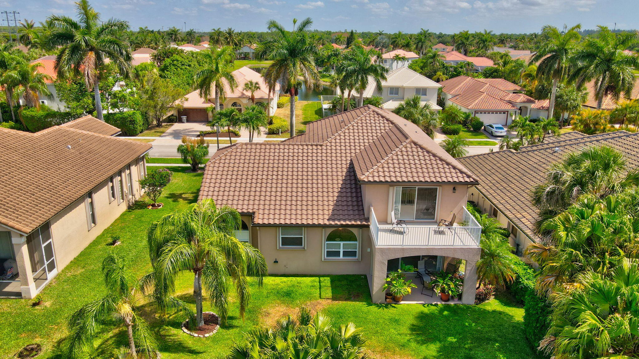 19586 Dinner Key Drive Boca Raton, FL 33498 - Photo 13 of 78 a aerial view of a house with a yard and potted plants