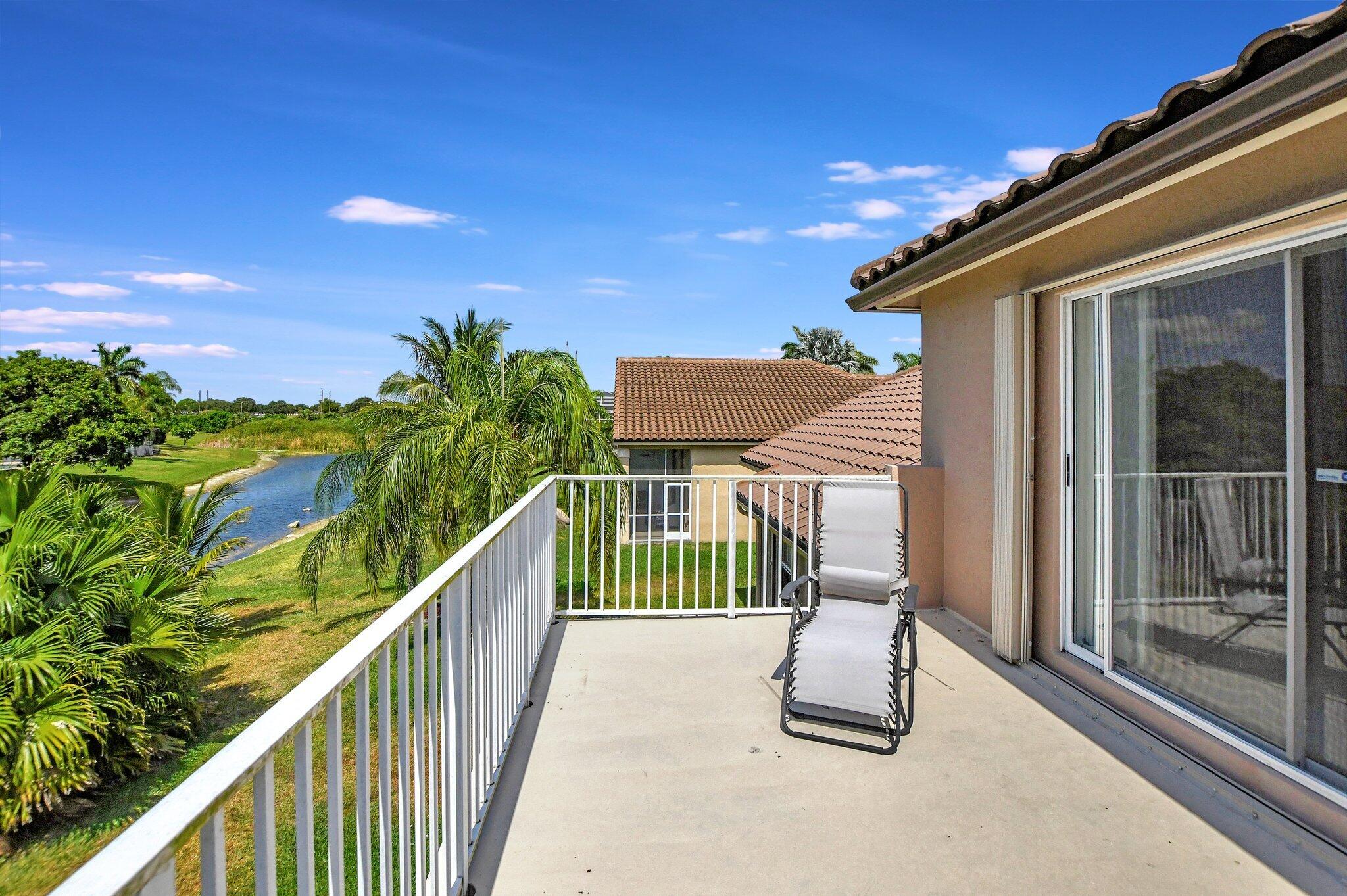 19586 Dinner Key Drive Boca Raton, FL 33498 - Photo 39 of 78 a balcony with view of street
