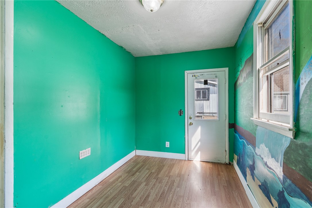 4024 Ridgeway Street Williamson, NY 14589 - Photo 13 of 28 A first floor room- was used as a bedroom but can