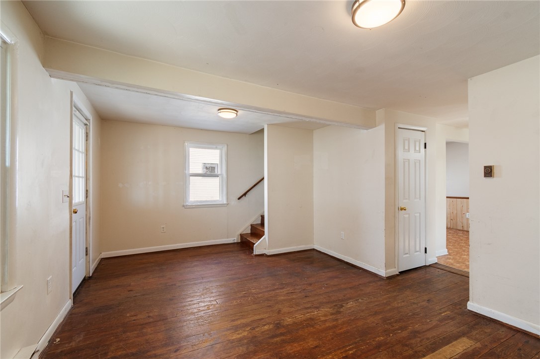 4024 Ridgeway Street Williamson, NY 14589 - Photo 16 of 28 The living room with stairs up to the TWO MORE BED