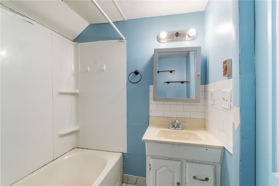 4024 Ridgeway Street Williamson, NY 14589 - Photo 20 of 28 The upstairs full bath - there are two adjacent be