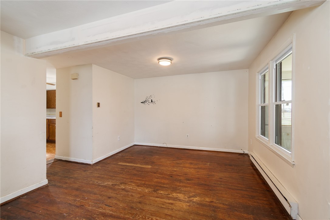 4024 Ridgeway Street Williamson, NY 14589 - Photo 9 of 28 The living room to the kitchen view - plenty of li