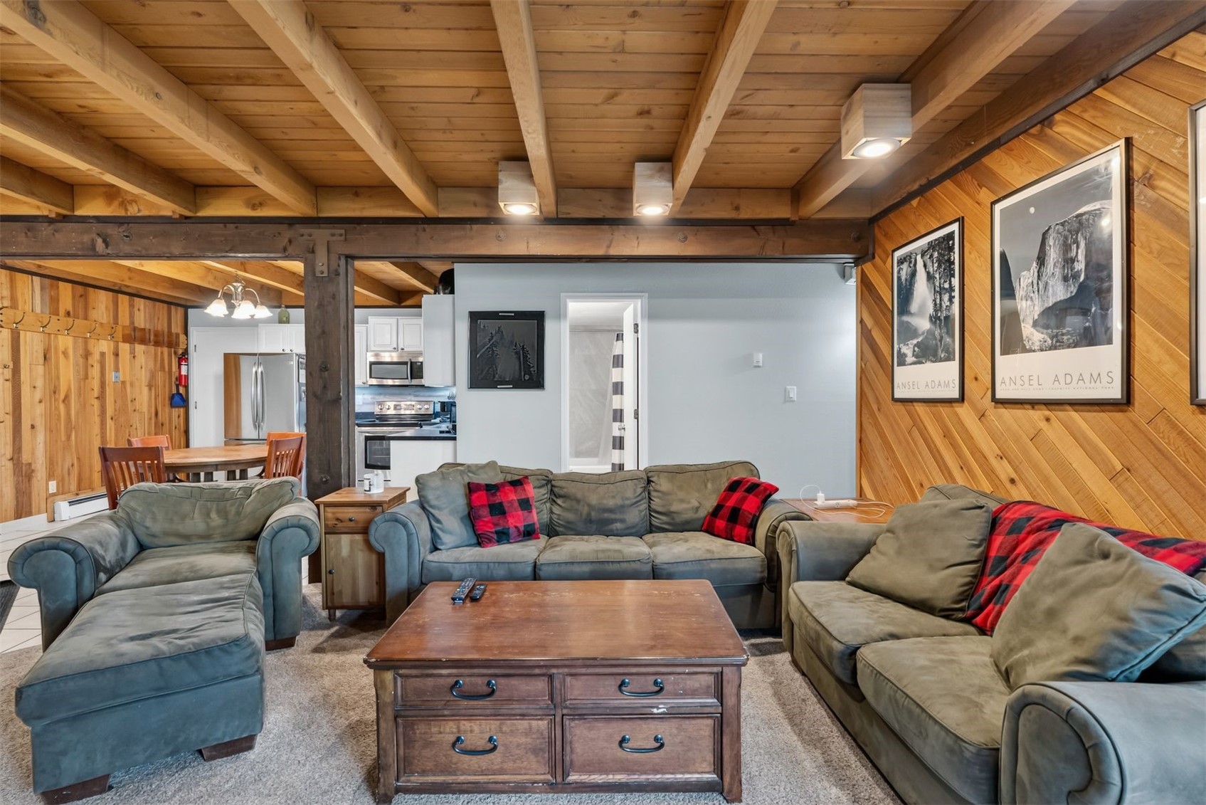8100 Ryan Gulch Road, Unit 106 Wildernest, CO 80498 - Photo 10 of 43 a living room with furniture and a large window