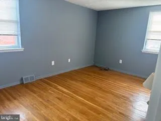 a view of empty room with windows