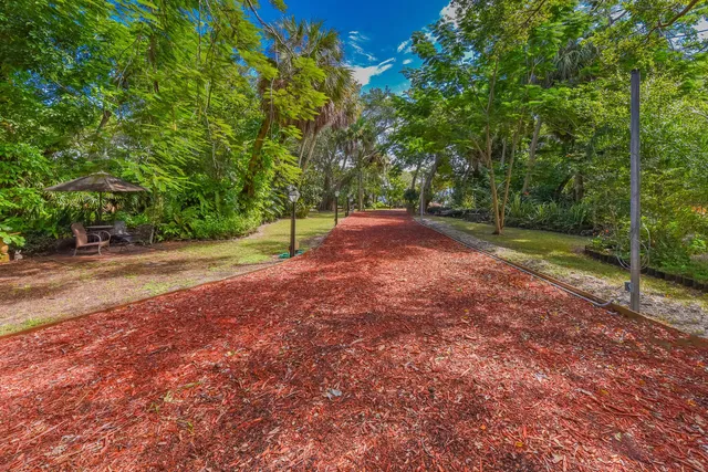a view of a dining room with furniture and a chandelier