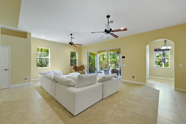 a view of an empty room with windows