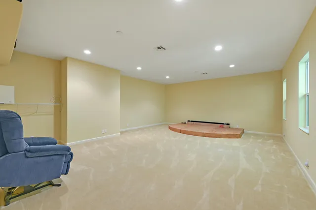 a bathroom with a granite countertop sink a mirror and shower