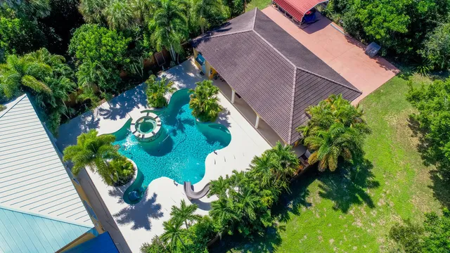 a kitchen with stainless steel appliances granite countertop a stove a refrigerator a sink and dishwasher