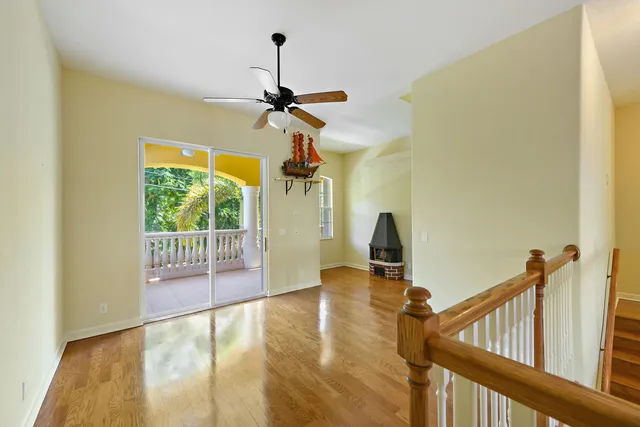 a view of a patio with table and chairs under an umbrella