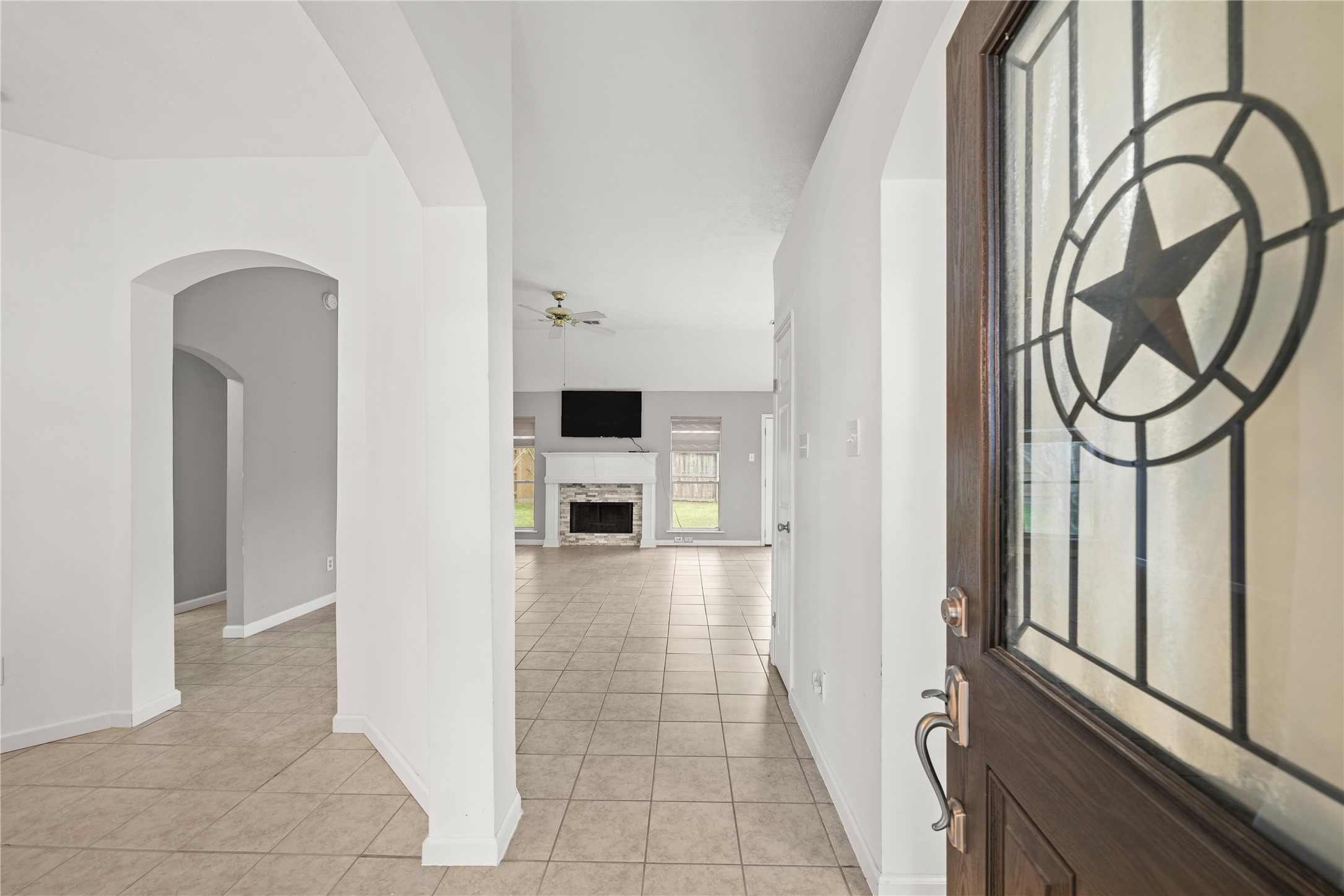 8134 Blue Jay Street Baytown, TX 77523 - Photo 6 of 31 As you enter the home, you’re greeted by a beautifully appointed foyer with soaring ceilings and custom crown molding that adds a touch of elegance.