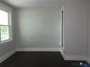 a view of balcony with wooden floor