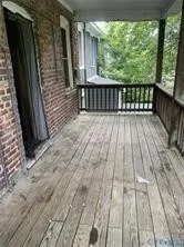 a view of a yard with large trees