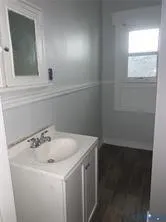a bathroom with a sink and cabinets
