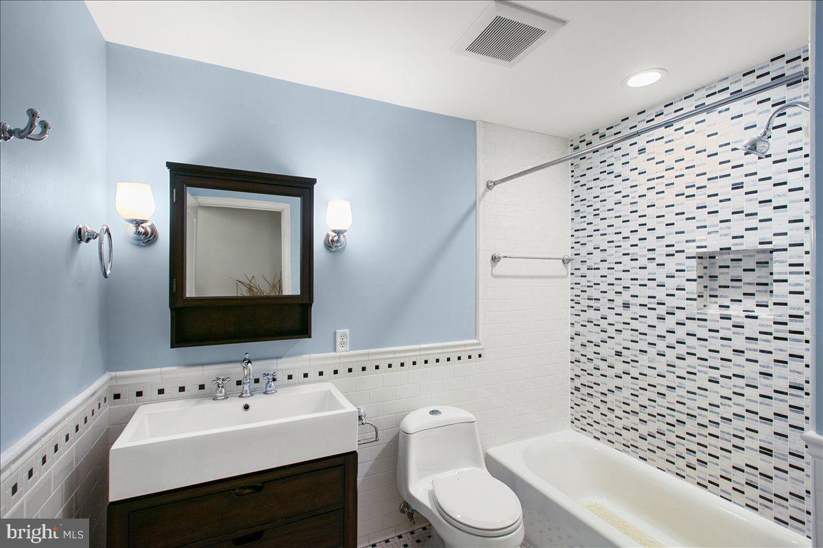 19266 Mockingbird Heights Road Triangle, VA 22172 - Photo 22 of 35 a bathroom with a sink toilet and mirror