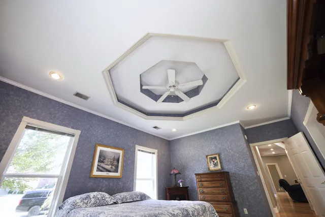 a bedroom with furniture and a window