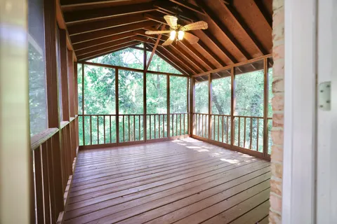 a view of porch with wooden floor