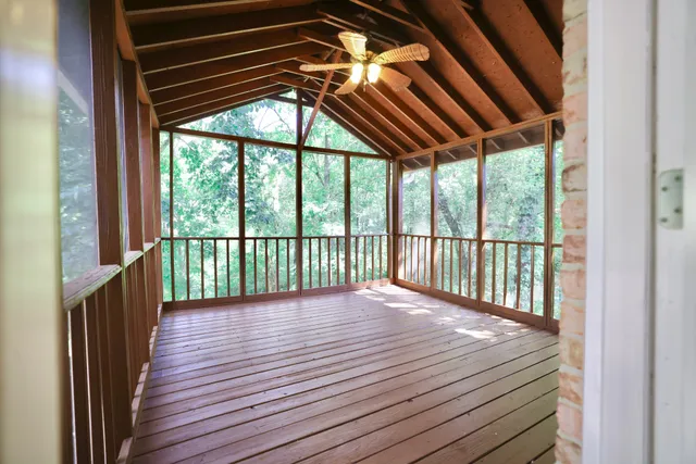 a view of porch with wooden floor