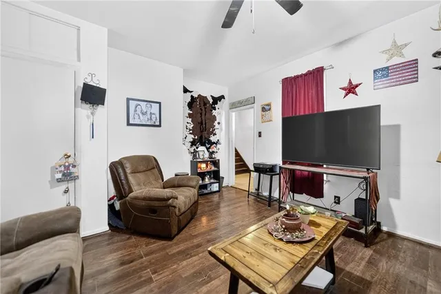 a view of a livingroom with furniture and window
