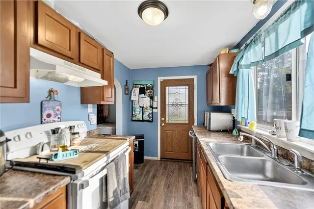 a kitchen with sink and window