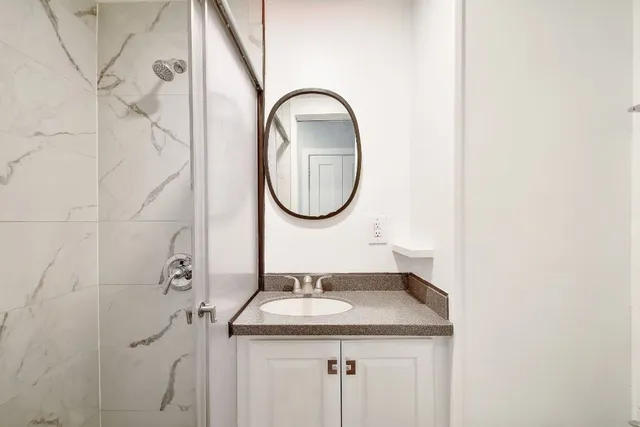 a bathroom with a sink and a mirror