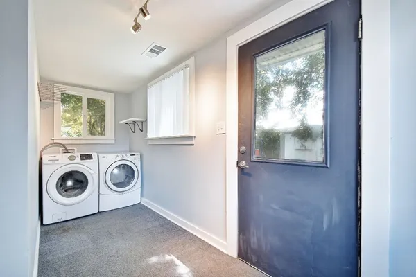 a utility room with dryer and washer