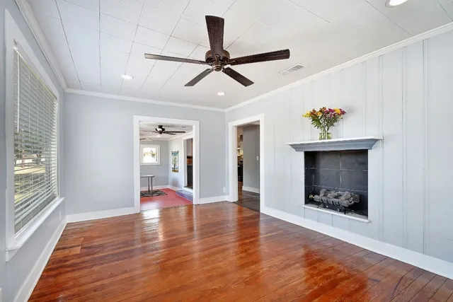 wooden floor in an empty room with a window