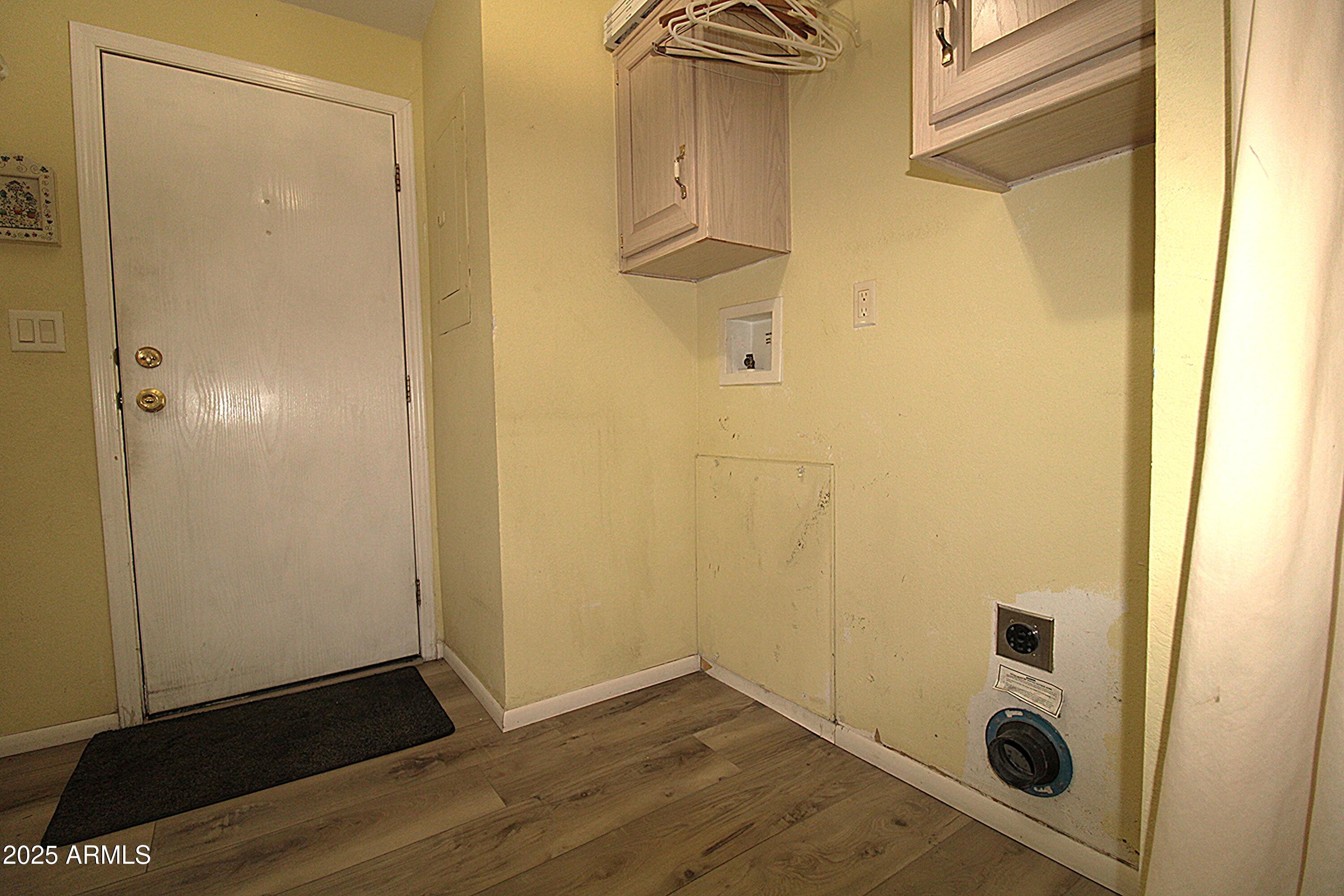 2400 East Baseline Avenue, Unit 232 Apache Junction, AZ 85119 - Photo 13 of 37 a view of a hallway with wooden floor