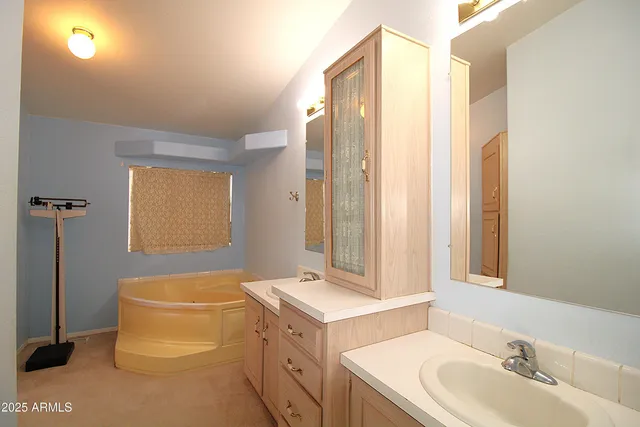 a bathroom with a sink a toilet and tub