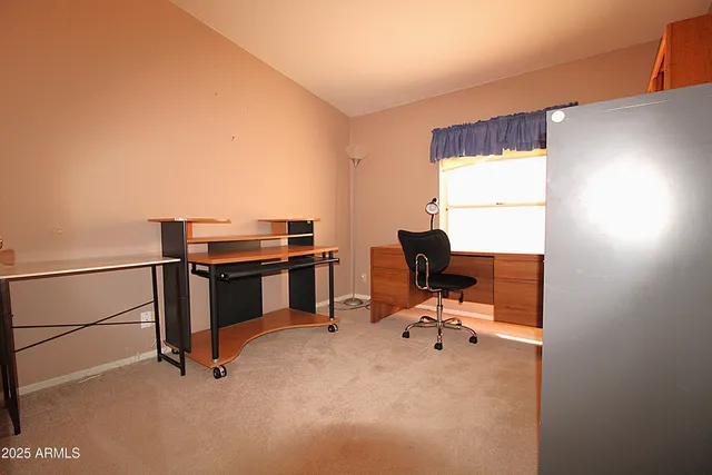 a view of a workspace with furniture