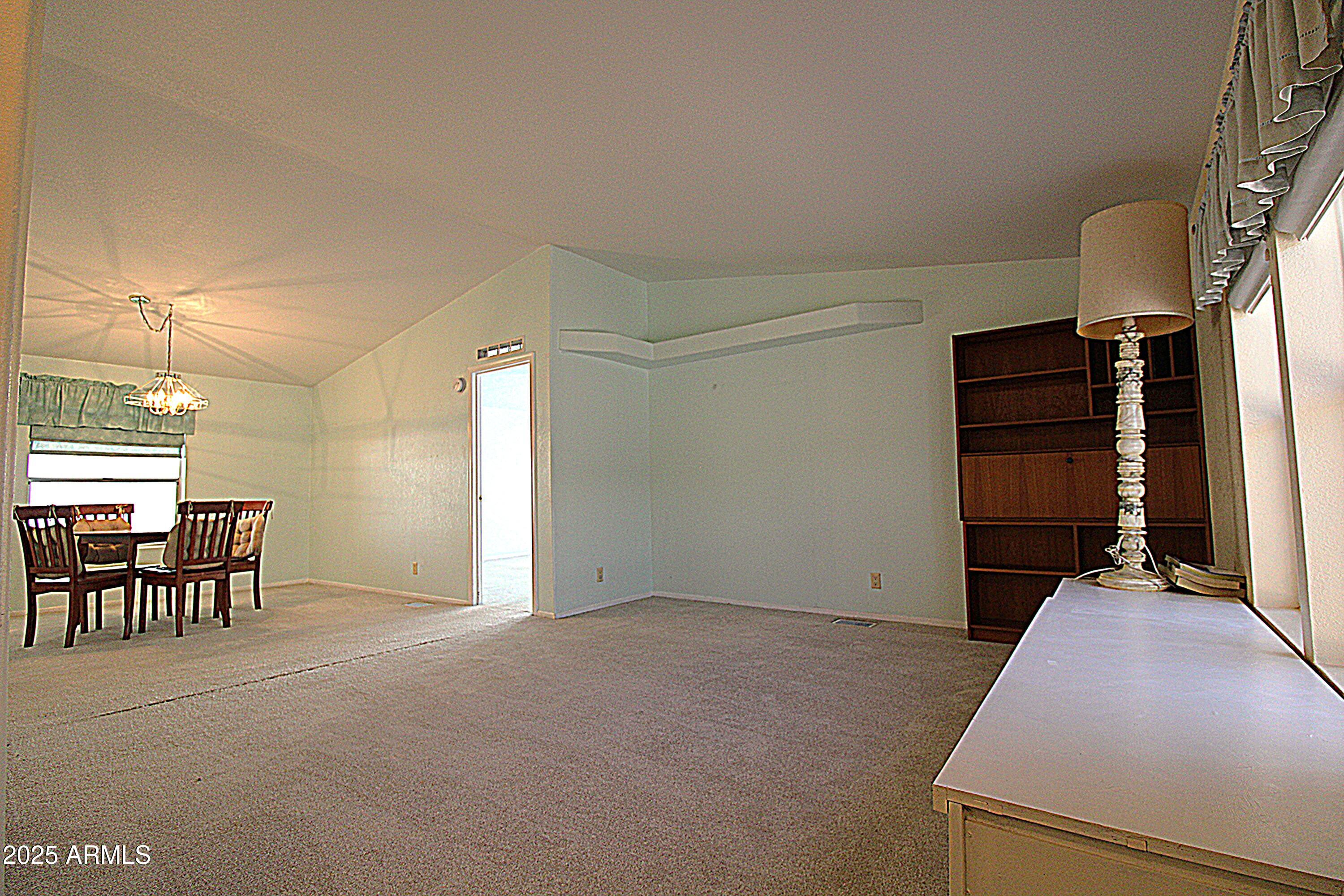 2400 East Baseline Avenue, Unit 232 Apache Junction, AZ 85119 - Photo 3 of 37 a view of a livingroom with furniture and a window