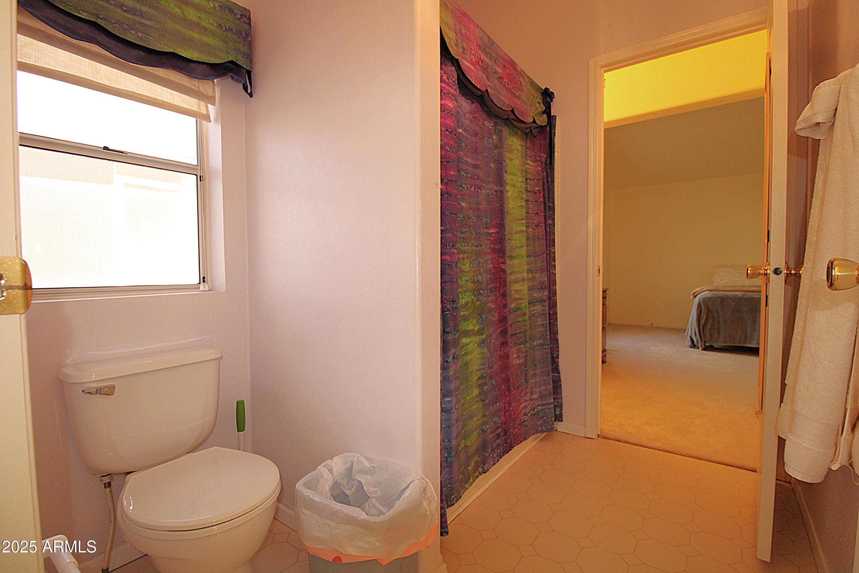 2400 East Baseline Avenue, Unit 232 Apache Junction, AZ 85119 - Photo 31 of 37 a bathroom with a toilet and a shower