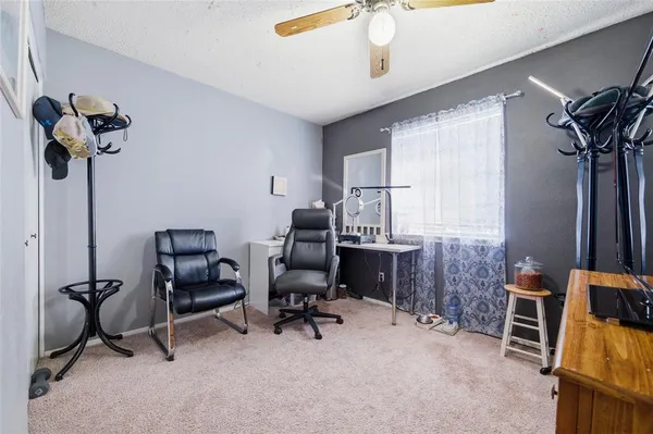 a view of a workspace with furniture