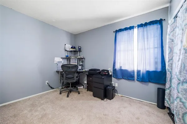 a workspace with furniture and a window