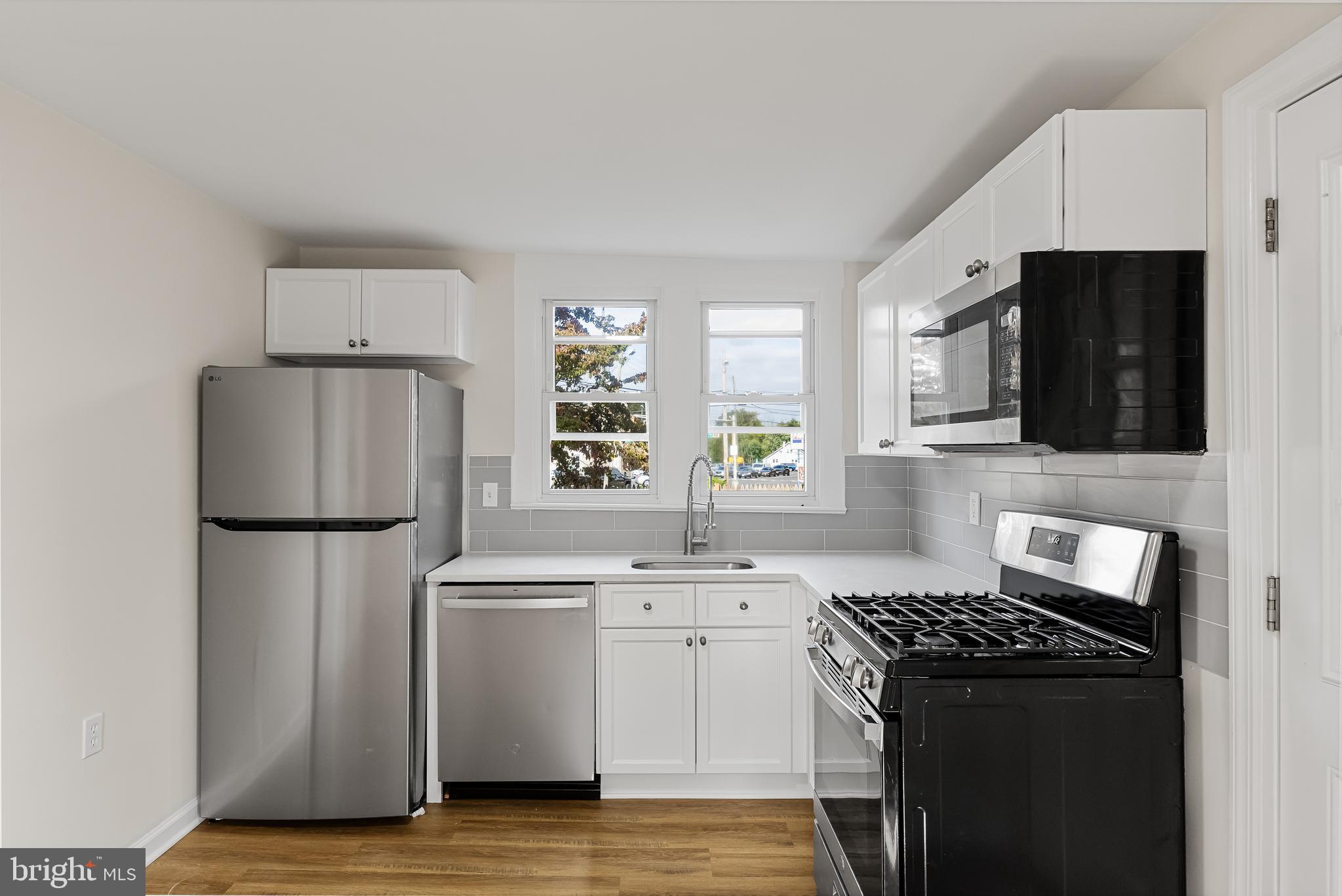 154 Kings Highway Mount Royal, NJ 08061 - Photo 18 of 45 a kitchen with a refrigerator sink and stove top oven