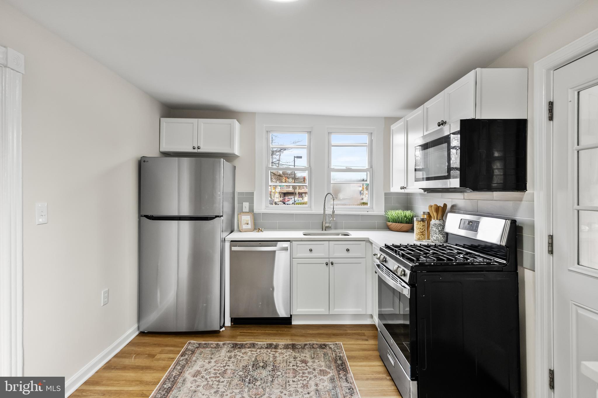154 Kings Highway Mount Royal, NJ 08061 - Photo 19 of 45 a kitchen with a refrigerator stove and sink