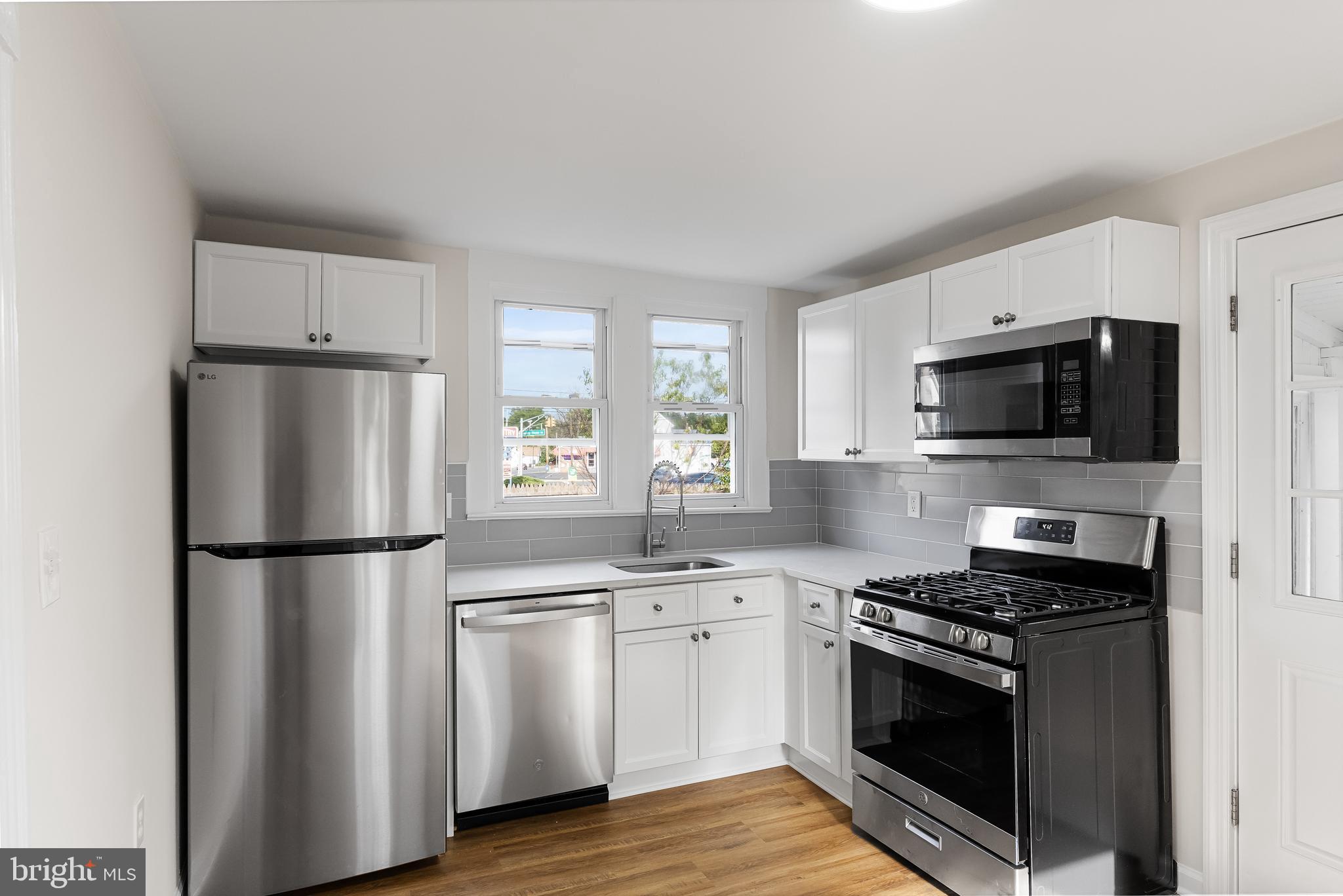 154 Kings Highway Mount Royal, NJ 08061 - Photo 20 of 45 a kitchen with stainless steel appliances a refrigerator stove and microwave