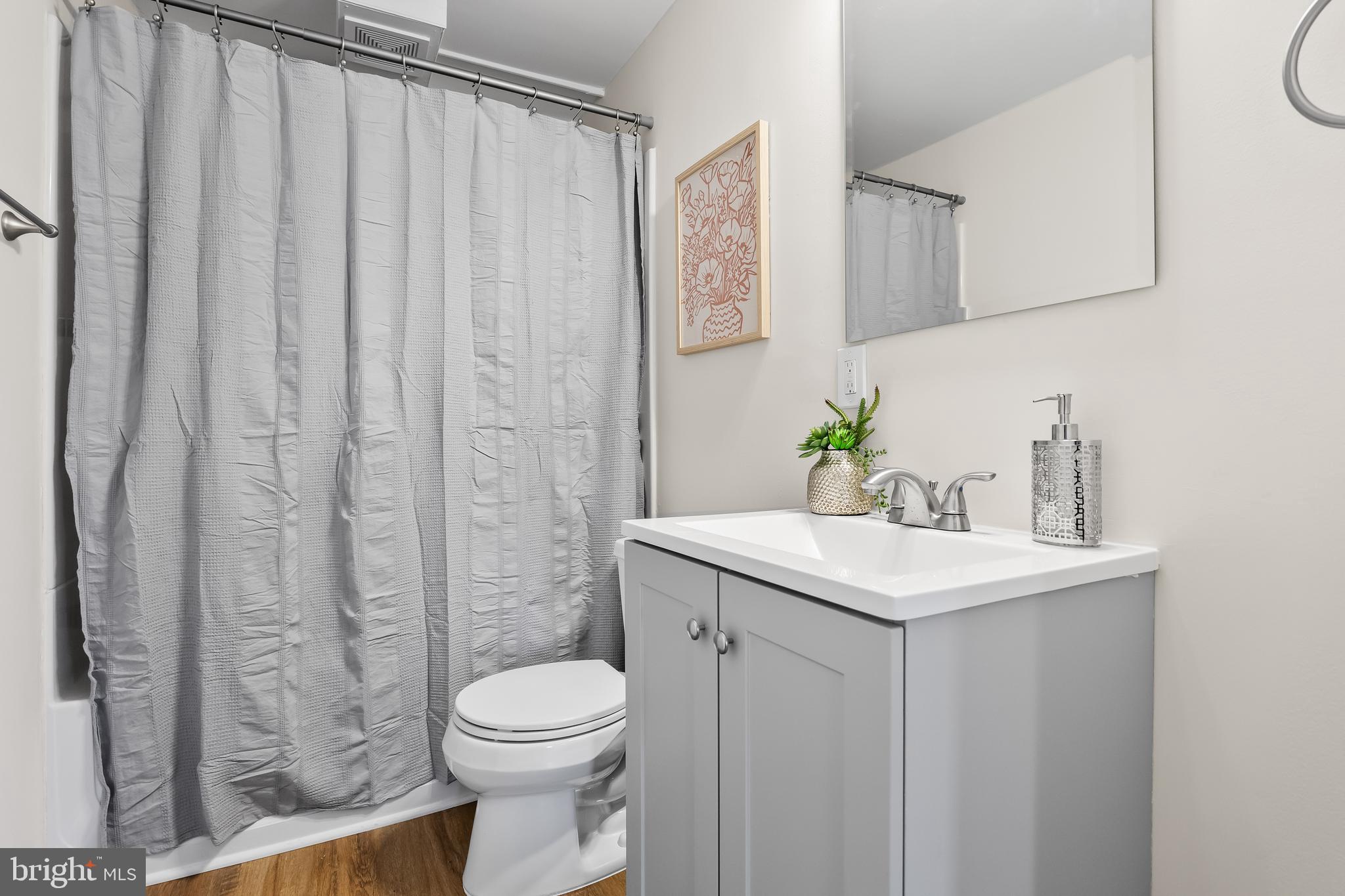 154 Kings Highway Mount Royal, NJ 08061 - Photo 33 of 45 a bathroom with a sink a toilet and shower curtain