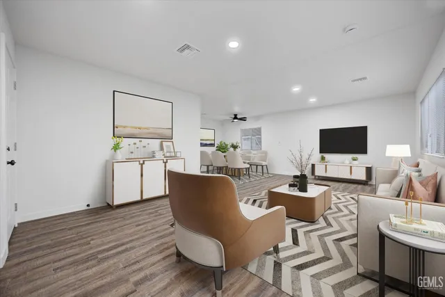 a view of a dining room with furniture and wooden floor