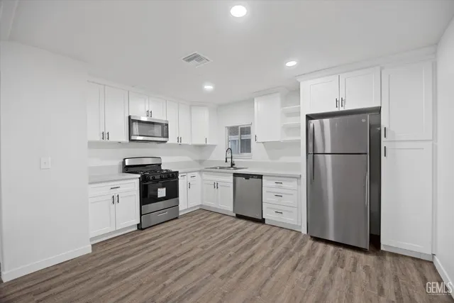 a kitchen with a stove and a microwave