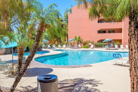 a view of a living room and balcony