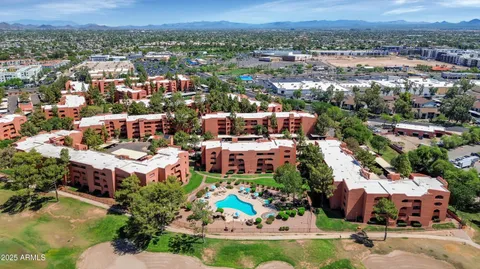 a view of a city with a lake