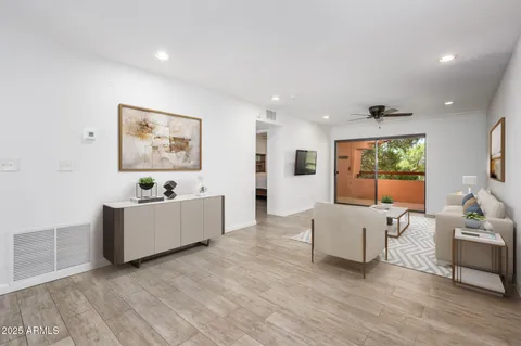 a living room with furniture and window