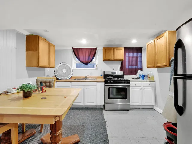 a kitchen with a appliances and cabinets